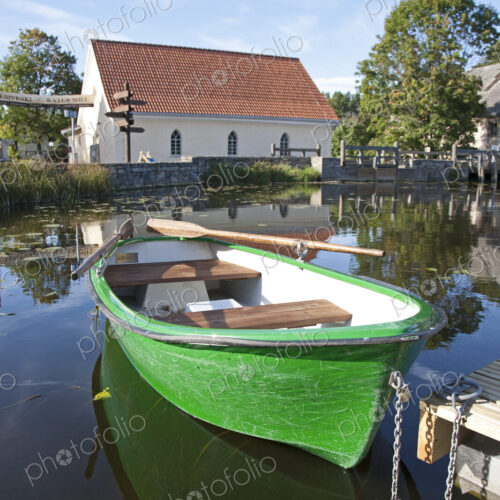 Rowboat Docked in a Pond