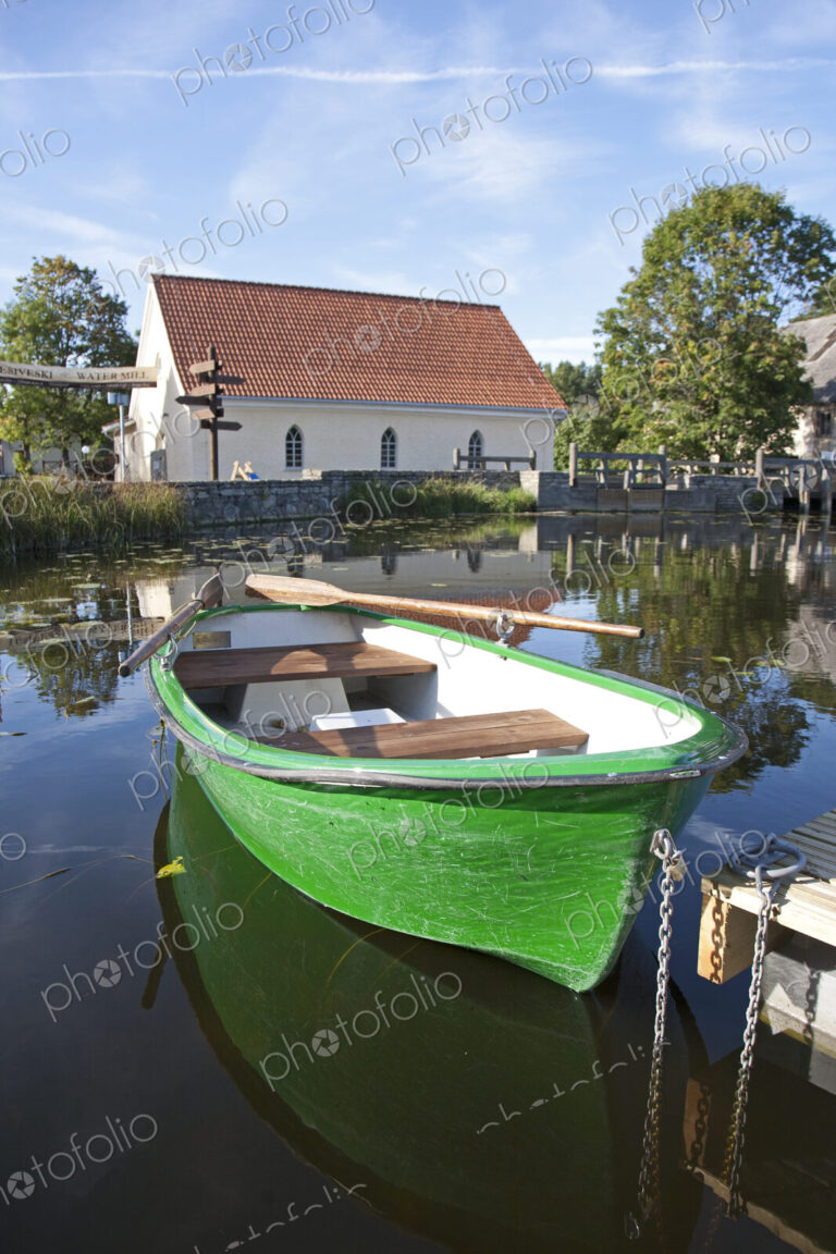 Rowboat Docked in a Pond