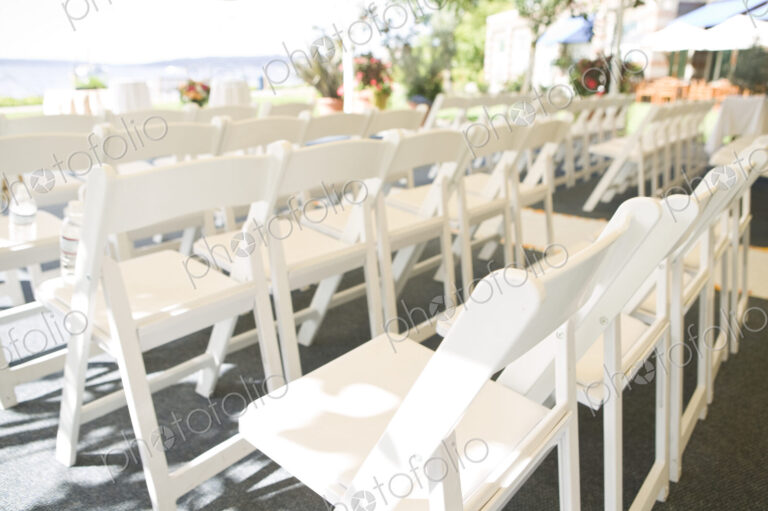 Rows of White Folding Chairs