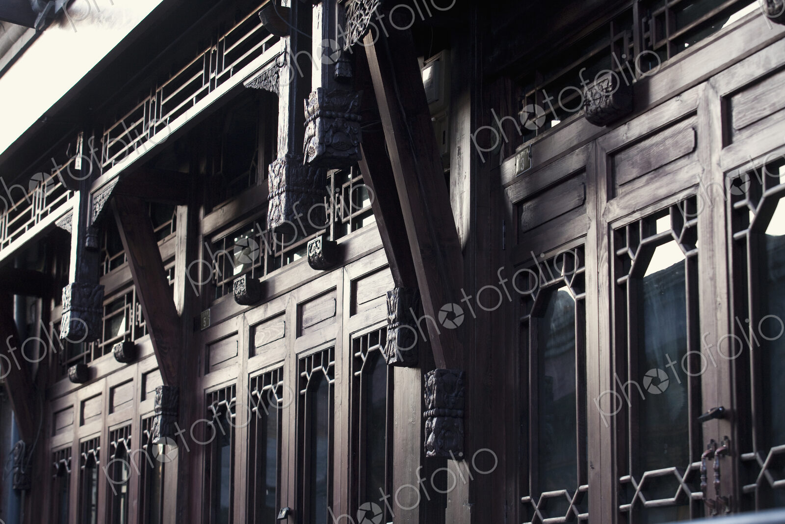 Rows of Wood Doors on Ornate Building Exterior