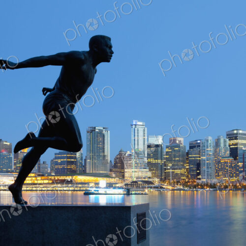 Running Sculpture With a Downtown Background