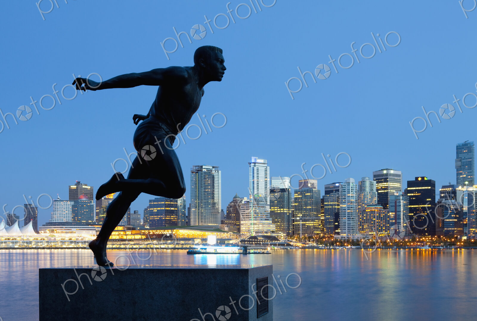 Running Sculpture With a Downtown Background