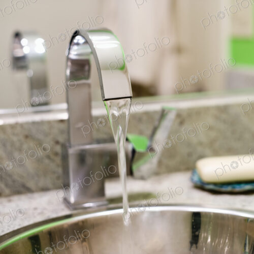 Runnning Faucet in the Bathroom