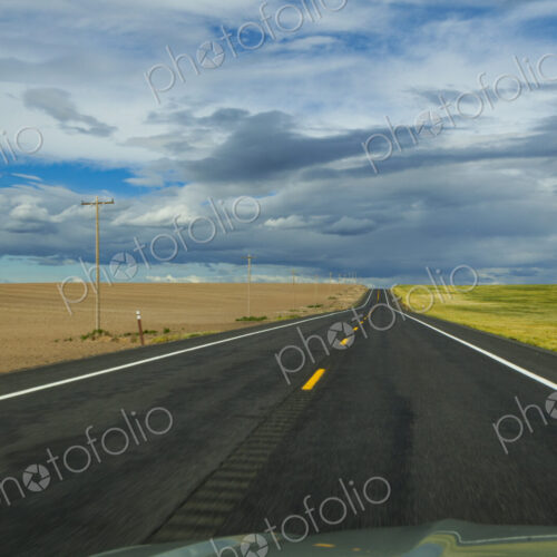 Rural two lane road through agricultural fields, Eastern Washington State.