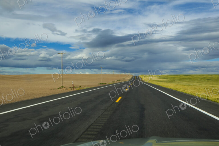 Rural two lane road through agricultural fields, Eastern Washington State.