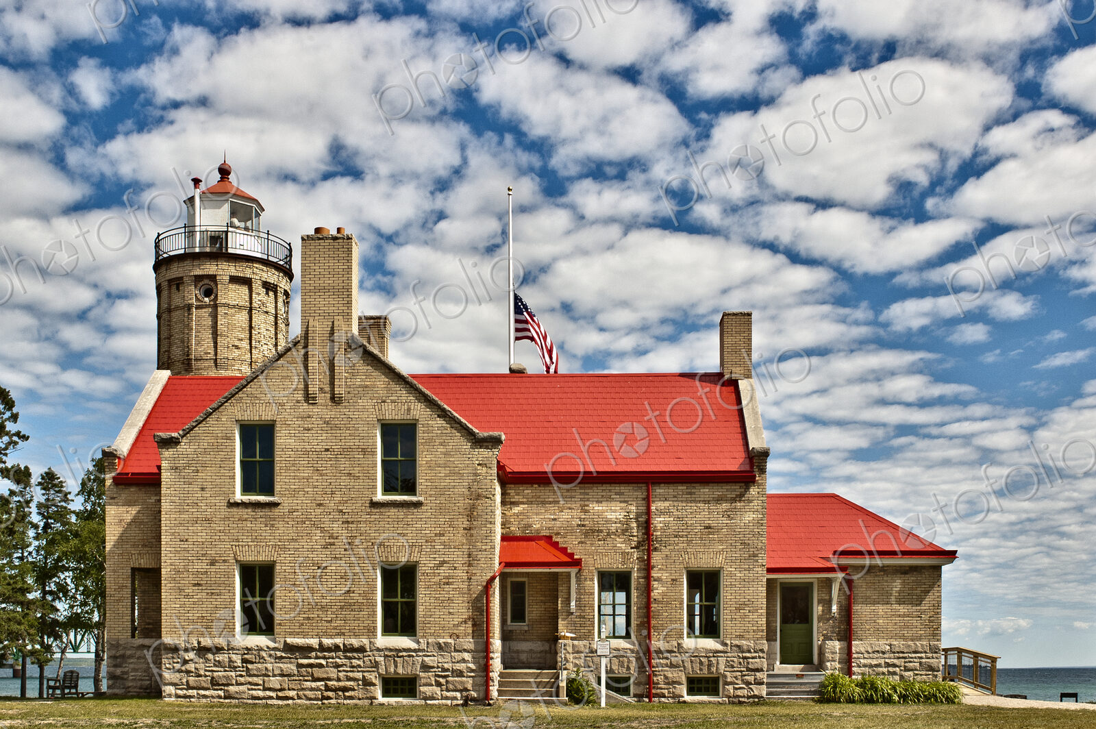 Rustic Lighthouse with a Flag at Half Mast