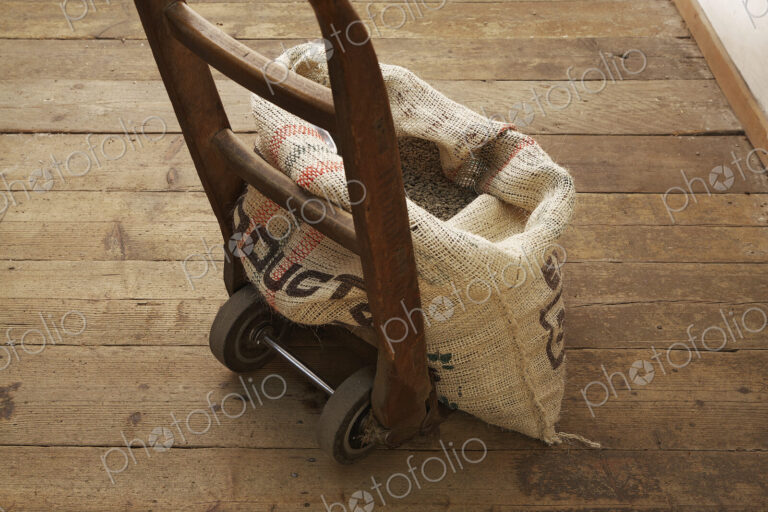 Sack of coffee beans on dolly
