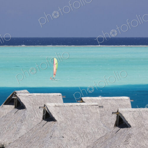Sailboat in bay at Bora Bora Sailboat in bay at Bora Bora