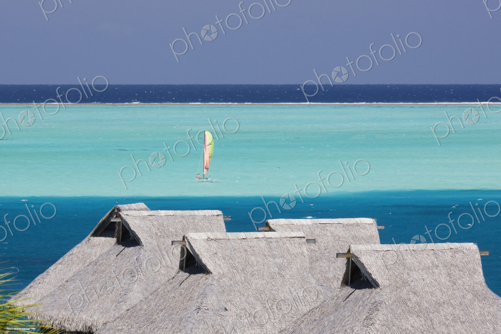 Sailboat in bay at Bora Bora