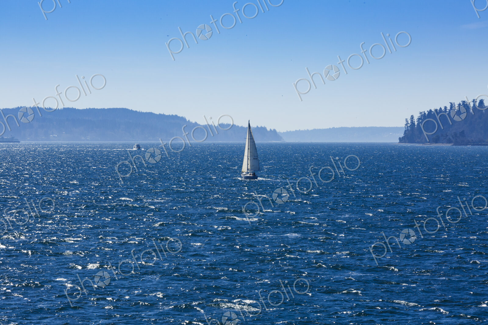 Sailboat on Puget Sound in windy conditions, near Seattle, WA USA