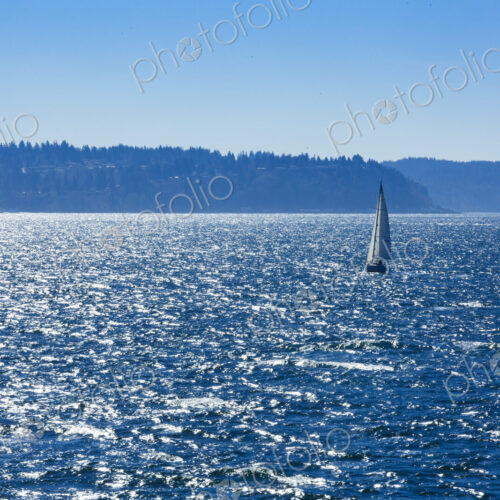 Sailboat on Puget Sound in windy conditions, near Seattle, WA USA Sailboat on Puget Sound in windy conditions, near Seattle, WA USA