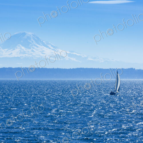 Sailboat on Puget Sound with view of Mt Rainier in windy conditions, near Seattle, WA USA Sailboat on Puget Sound with view of Mt Rainier in windy conditions, near Seattle, WA USA