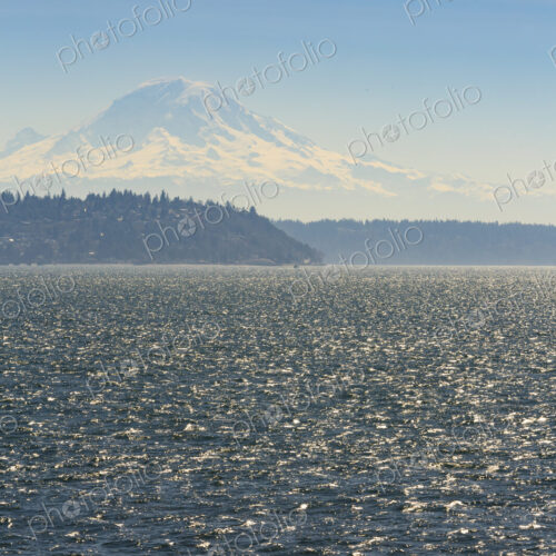 Sailboat on Puget Sound with view of Mt Rainier in windy conditions, near Seattle, WA USA Sailboat on Puget Sound with view of Mt Rainier in windy conditions, near Seattle, WA USA