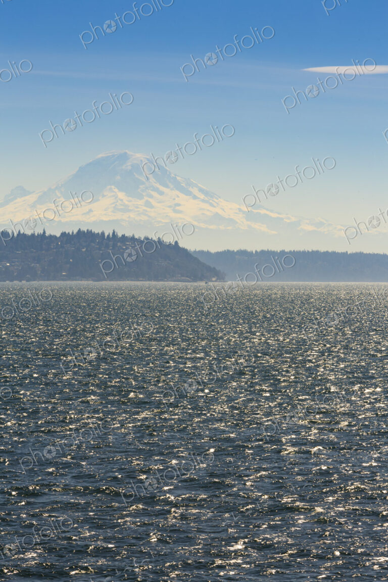 Sailboat on Puget Sound with view of Mt Rainier in windy conditions, near Seattle, WA USA