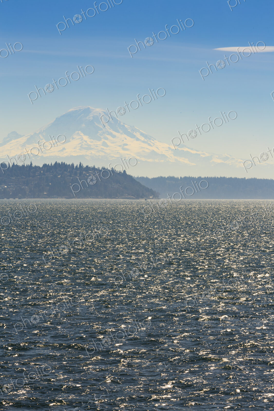 Sailboat on Puget Sound with view of Mt Rainier in windy conditions, near Seattle, WA USA