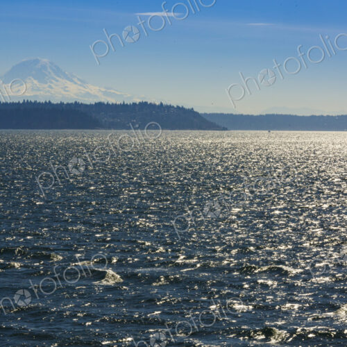 Sailboat on Puget Sound with view of Mt Rainier in windy conditions, near Seattle, WA USA Sailboat on Puget Sound with view of Mt Rainier in windy conditions, near Seattle, WA USA