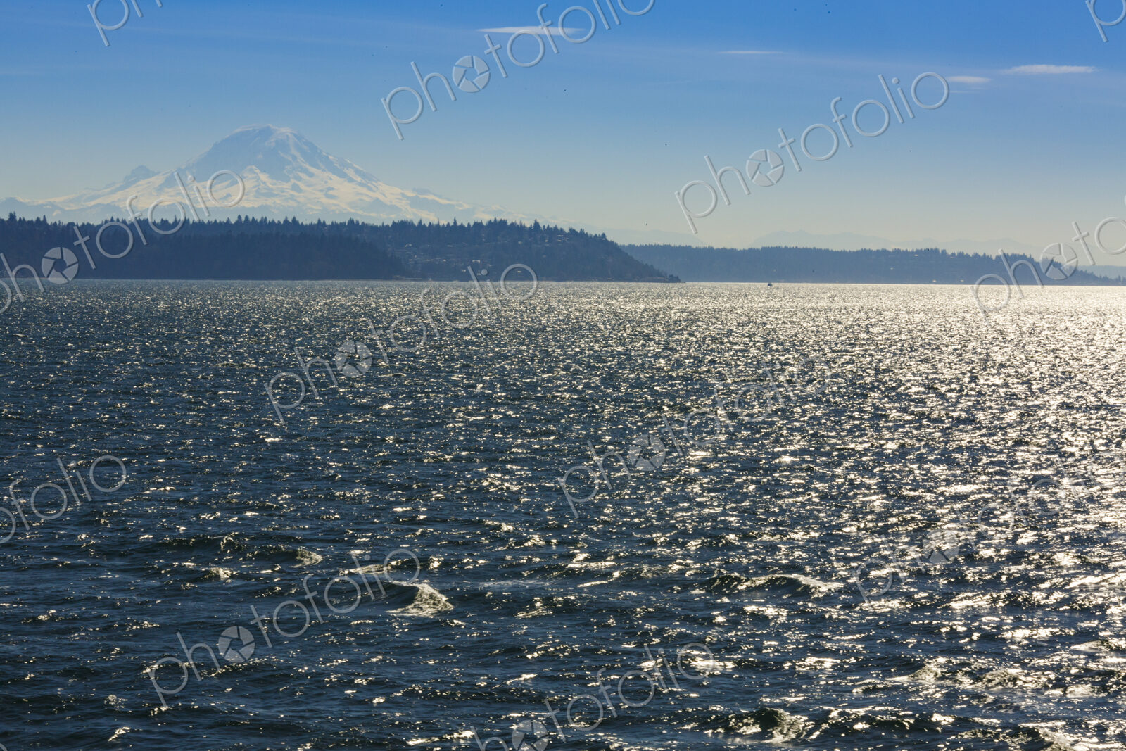 Sailboat on Puget Sound with view of Mt Rainier in windy conditions, near Seattle, WA USA