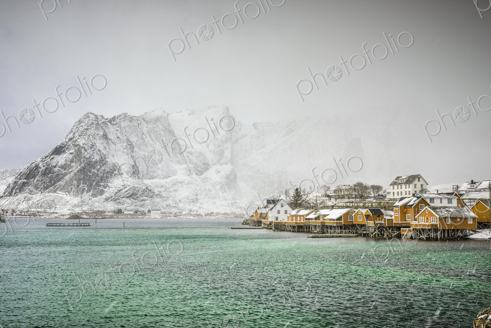 Sakrisoya Island, the mountain coastline and small town in the Lofoten islands…