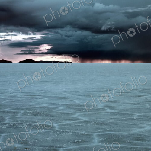 Salt flats, a cracked pattern in the crust of the ground, view to the horizon and… Salt flats, a cracked pattern in the crust of the ground, view to the horizon and…