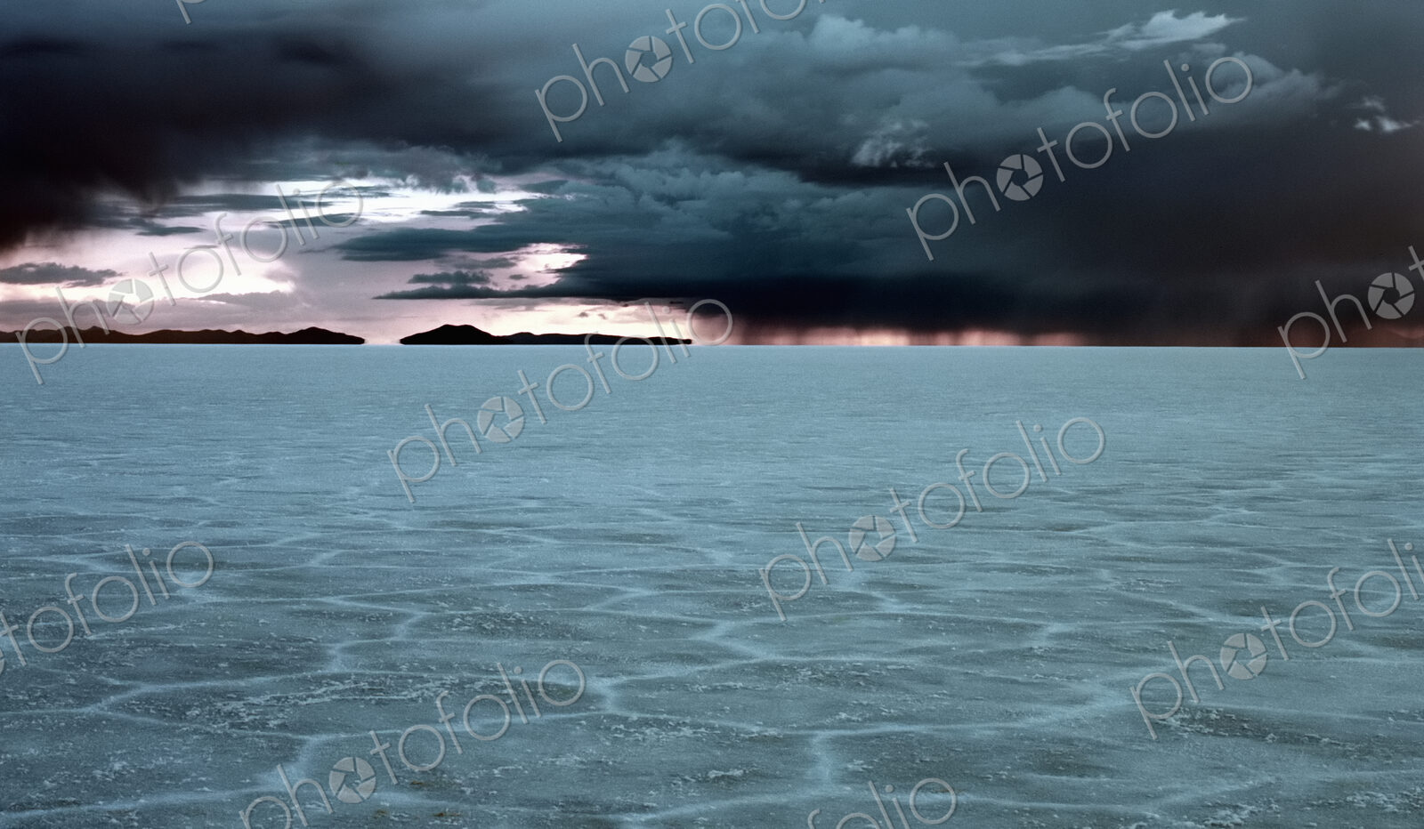 Salt flats, a cracked pattern in the crust of the ground, view to the horizon and…