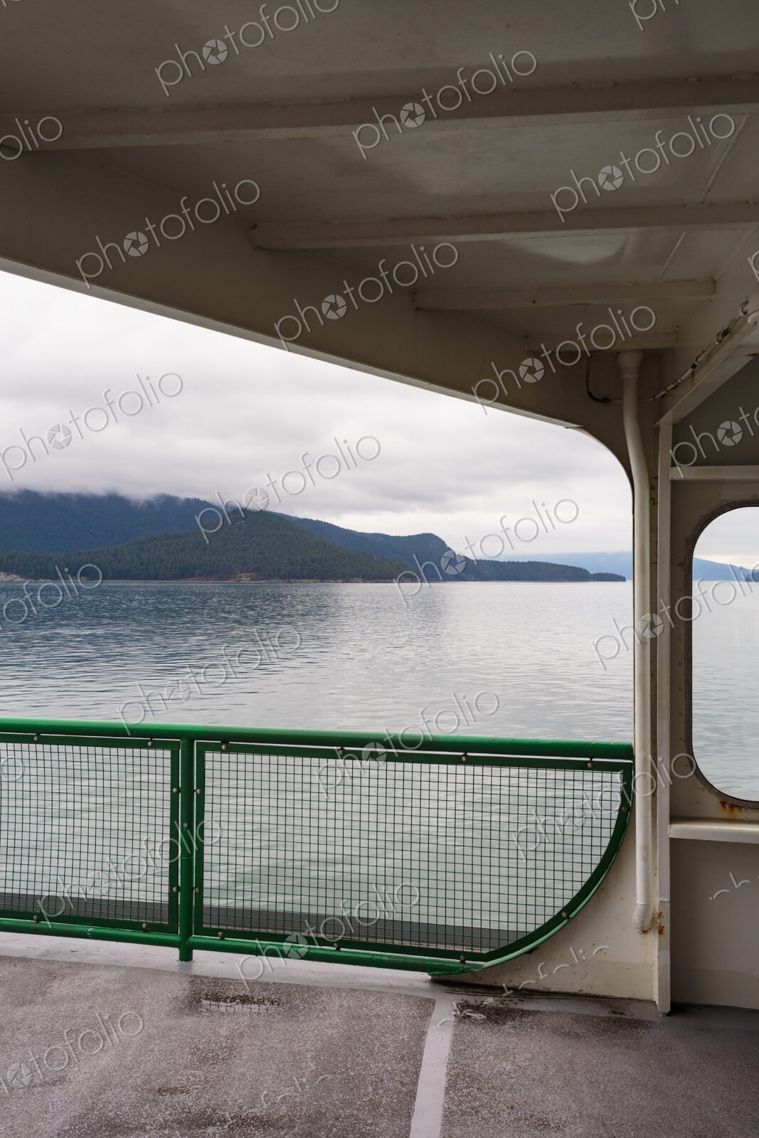 San Juan Islands ferry, a view from the deck of islands and calm water.