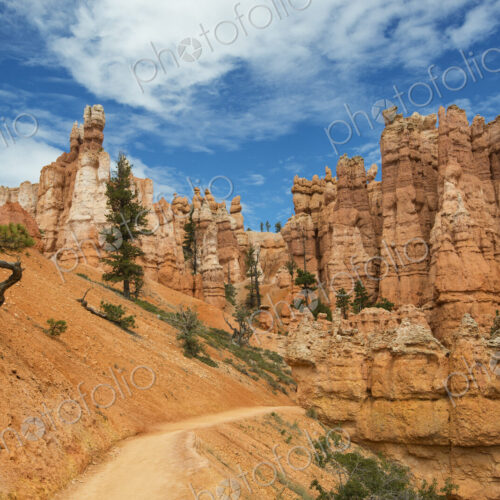 Sandstone pillars and a road through the desert.