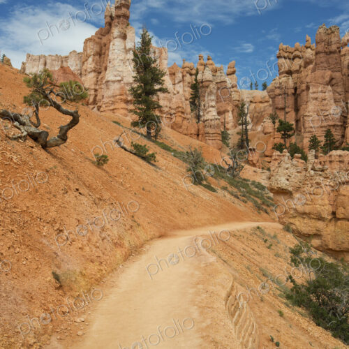 Sandstone pillars and a road through the desert.