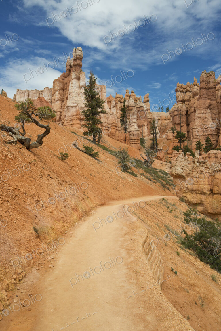 Sandstone pillars and a road through the desert.