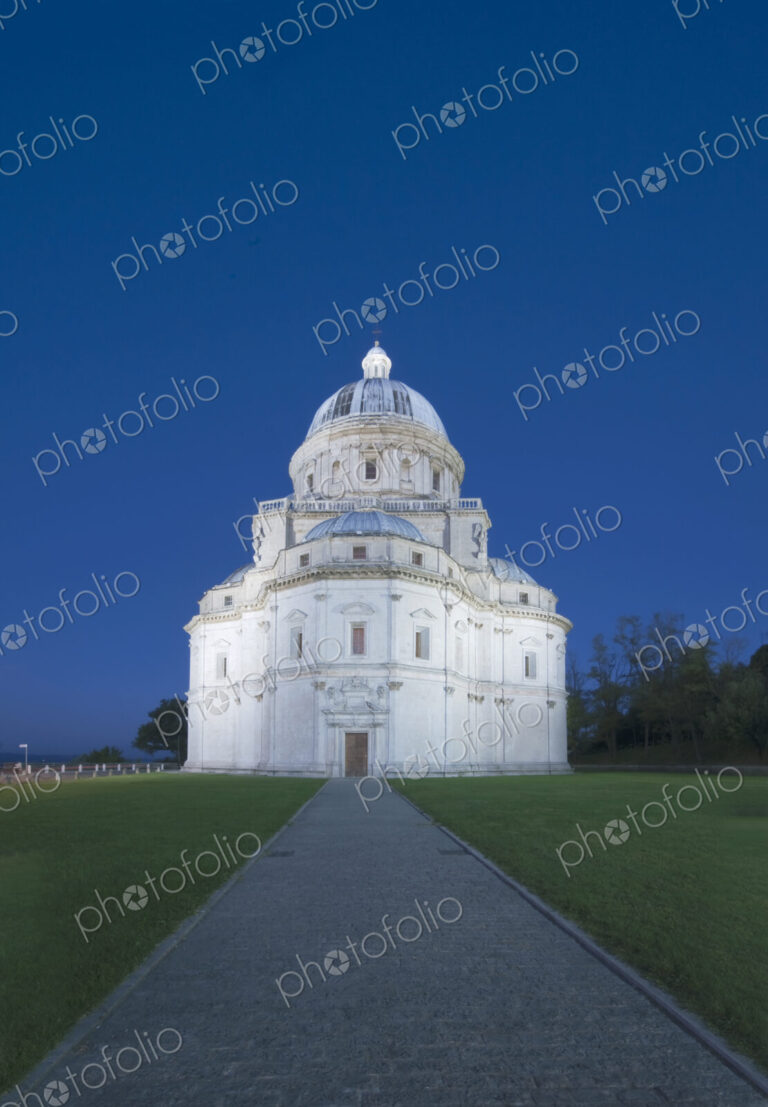 Santa Maria della Consolazione Church in Todi, the pale exterior lit up.