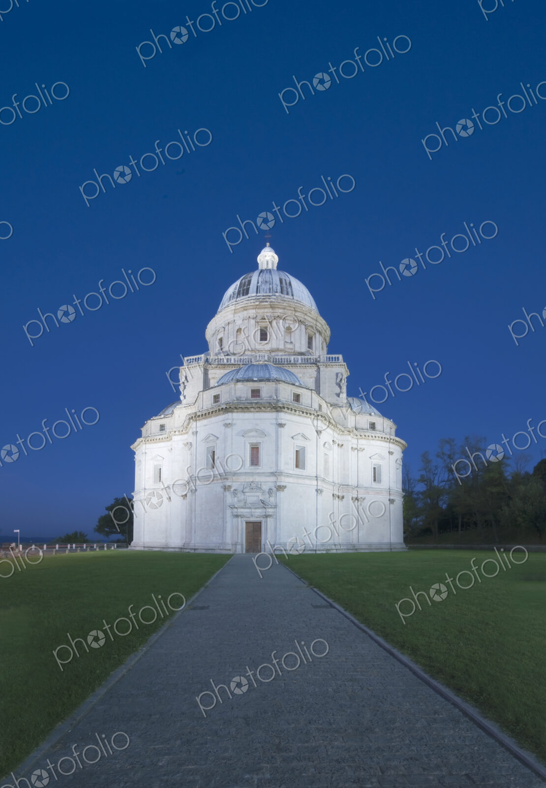 Santa Maria della Consolazione Church in Todi, the pale exterior lit up.