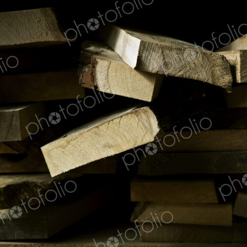Sawn pieces of wood, offcuts, in a wood workshop. Sawn pieces of wood, offcuts, in a wood workshop.