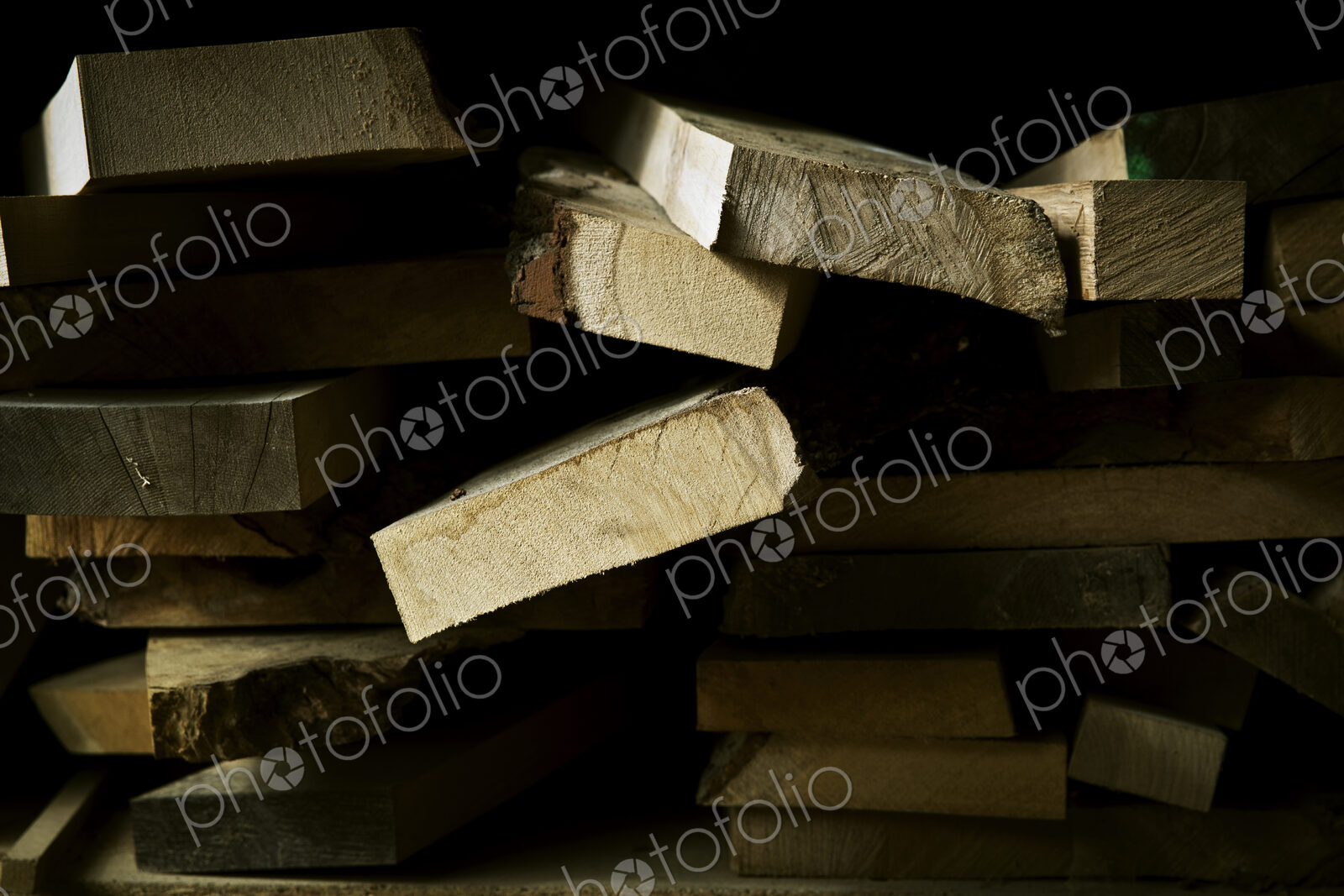 Sawn pieces of wood, offcuts, in a wood workshop.