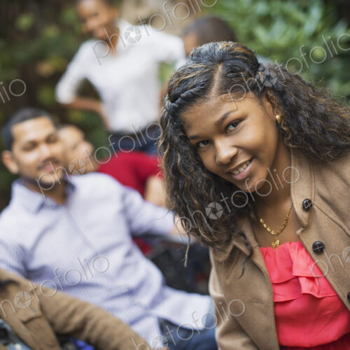 Scenes from urban life in New York City. A group of friends sitting together in a… Scenes from urban life in New York City. A group of friends sitting together in a…