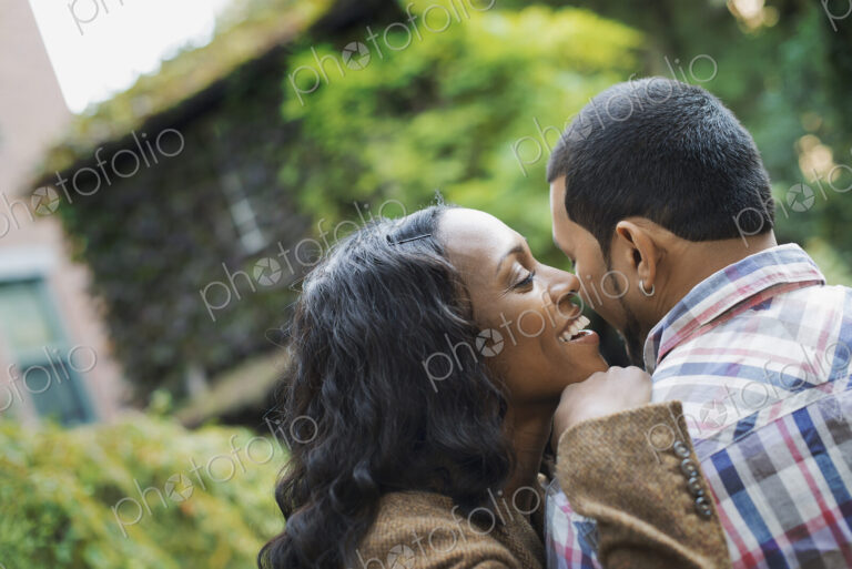 Scenes from urban life in New York City. A man and a woman, a couple hugging each other.