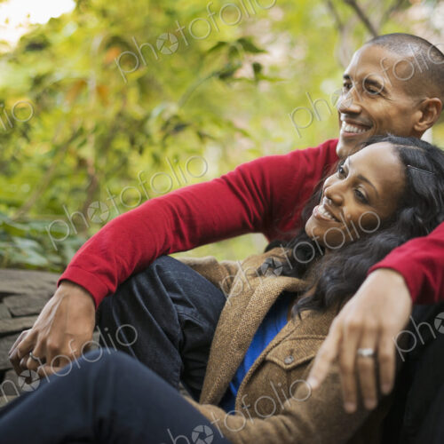 Scenes from urban life in New York City. A man and a woman, a couple sitting close… Scenes from urban life in New York City. A man and a woman, a couple sitting close…