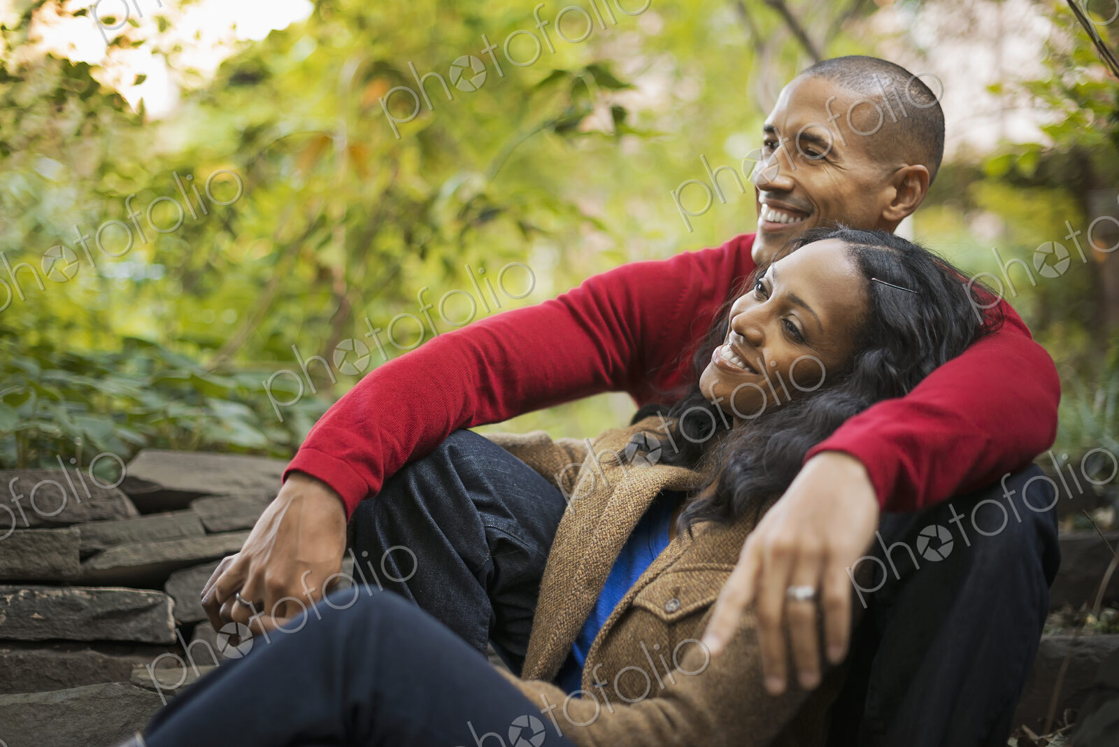 Scenes from urban life in New York City. A man and a woman, a couple sitting close…