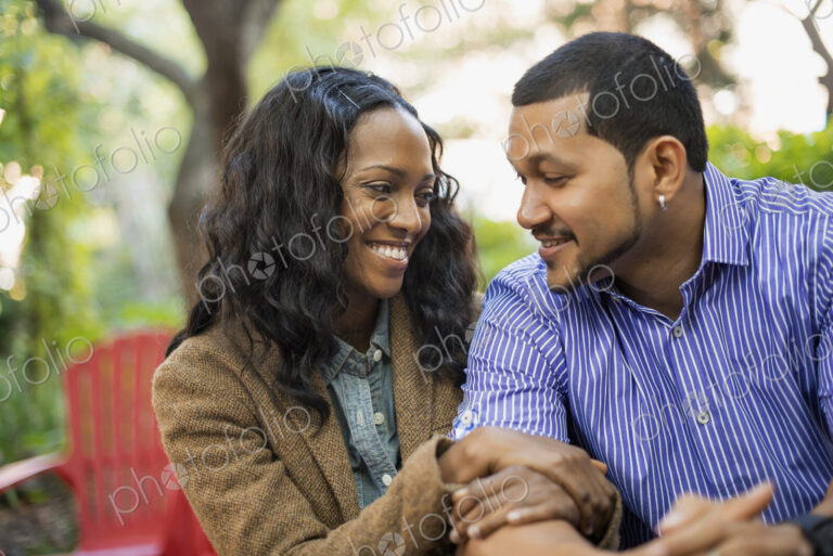Scenes from urban life in New York City. A man and a woman, a couple with linked arms…