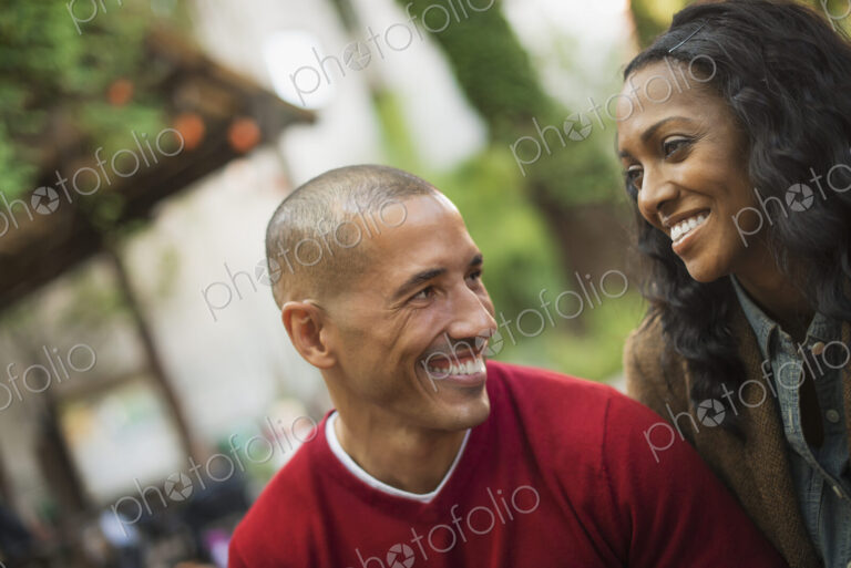 Scenes from urban life in New York City. A man and a woman, a couple. Looking at each…