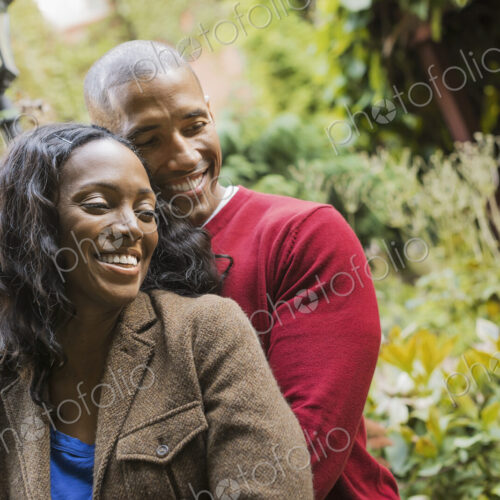 Scenes from urban life in New York City. A man and a woman, hugging each other in an… Scenes from urban life in New York City. A man and a woman, hugging each other in an…