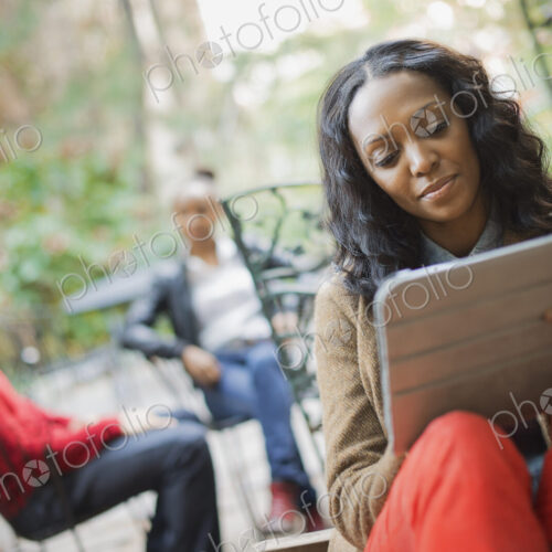 Scenes from urban life in New York City. Outdoors. Two people in background. A woman…