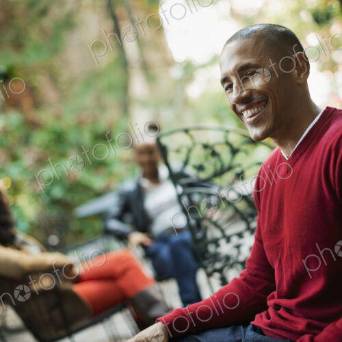 Scenes from urban life in New York City. Three people sitting in an outdoor space.… Scenes from urban life in New York City. Three people sitting in an outdoor space.…