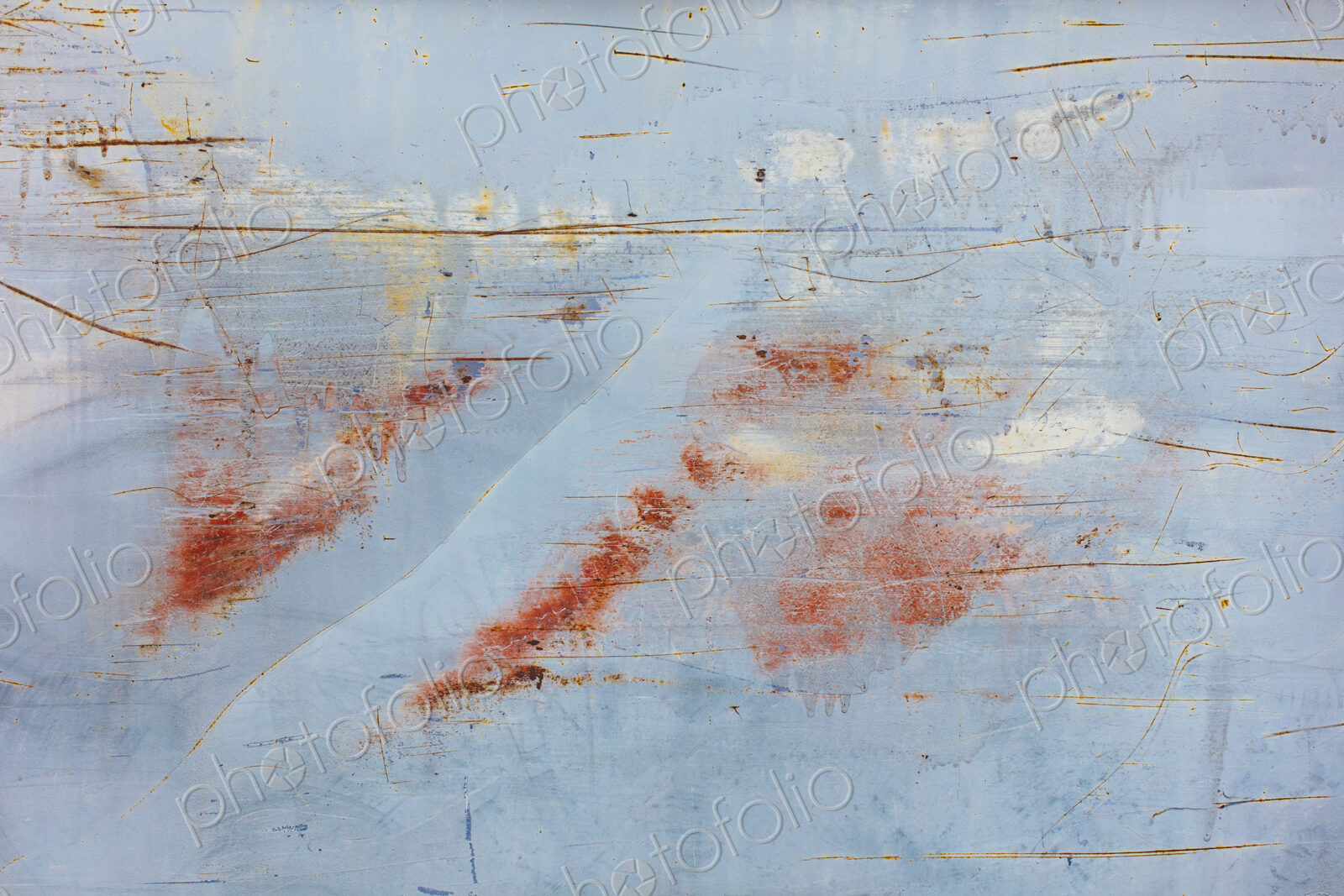 Scratch and rust markings on old metal wall
