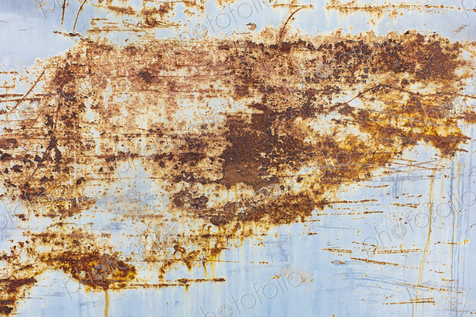 Scratch and rust markings on old metal wall, close up