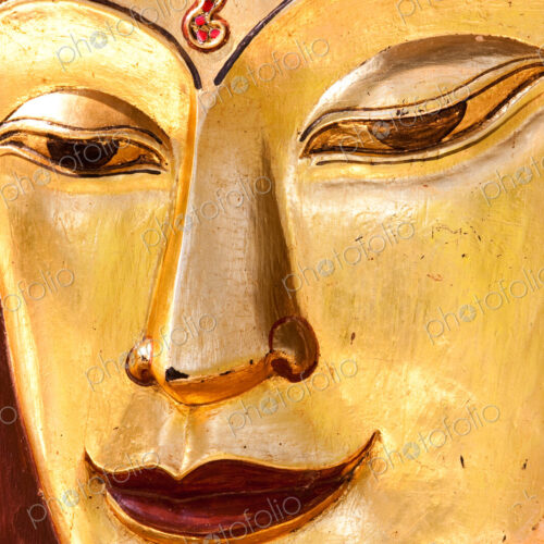 Sculpture of a Buddha. Close up of the face, Mandalay, Myanmar Sculpture of a Buddha. Close up of the face, Mandalay, Myanmar