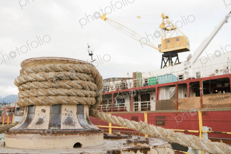 Seaport, dockside, large boat moored, thick ropes