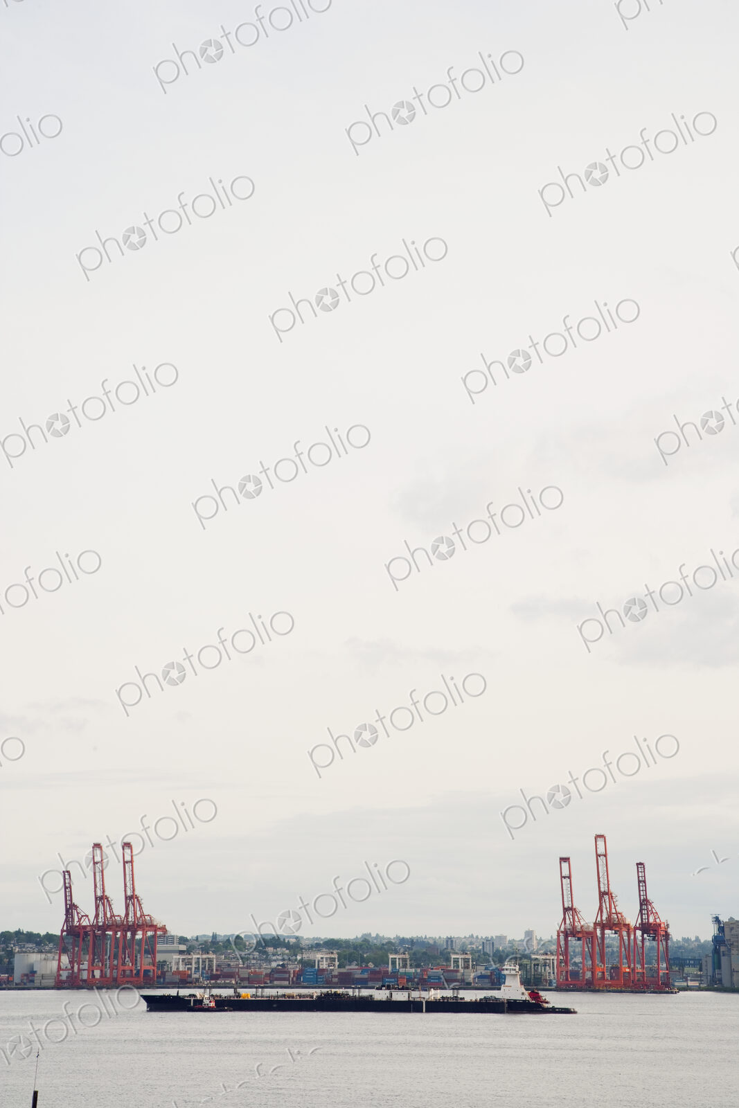 Seaport with ships and barges on the water