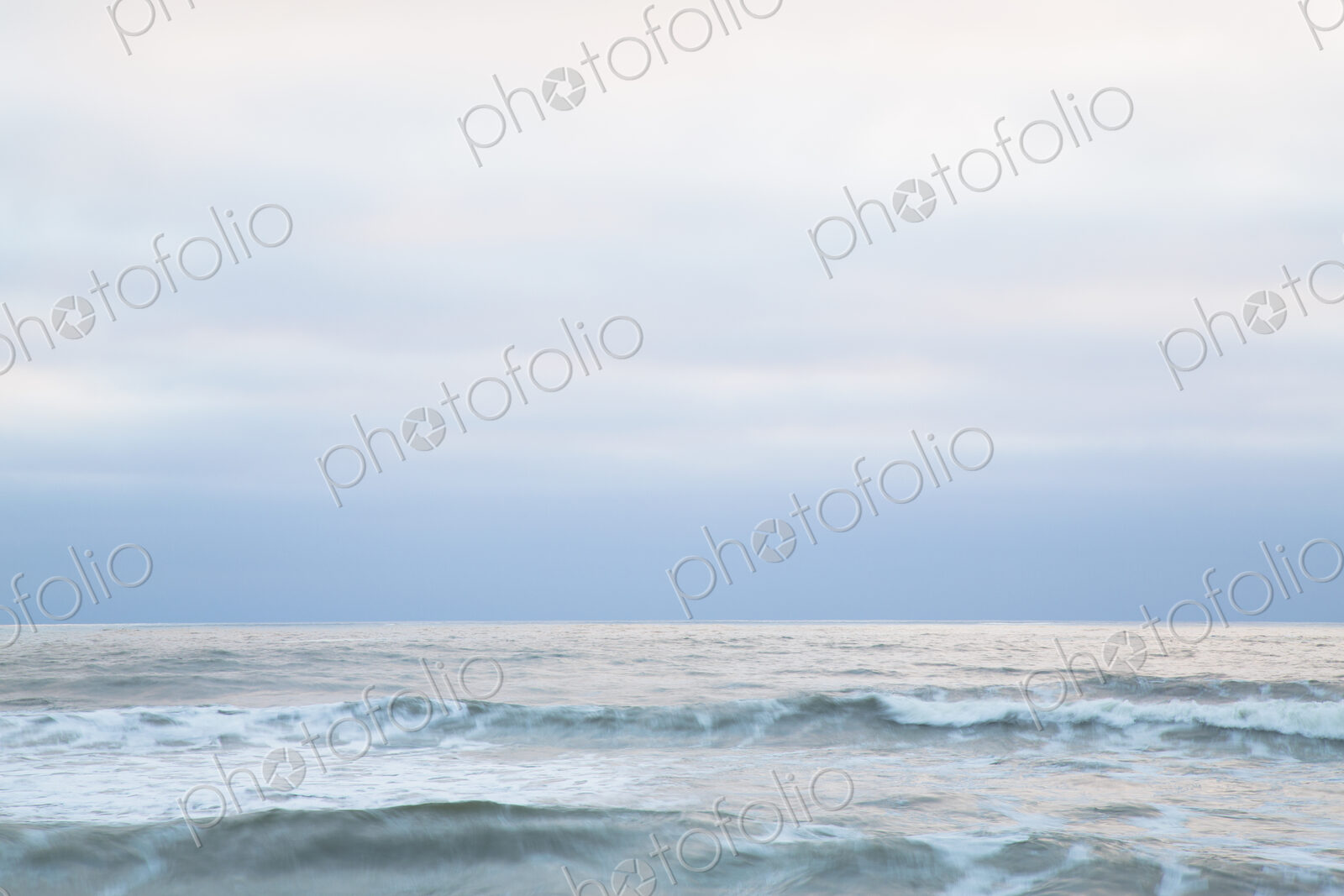 Seascape at dusk on the Pacific Ocean coastline.