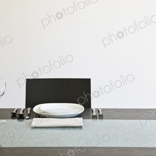 Seat at a dinner table set for a meal. Seat at a dinner table set for a meal.