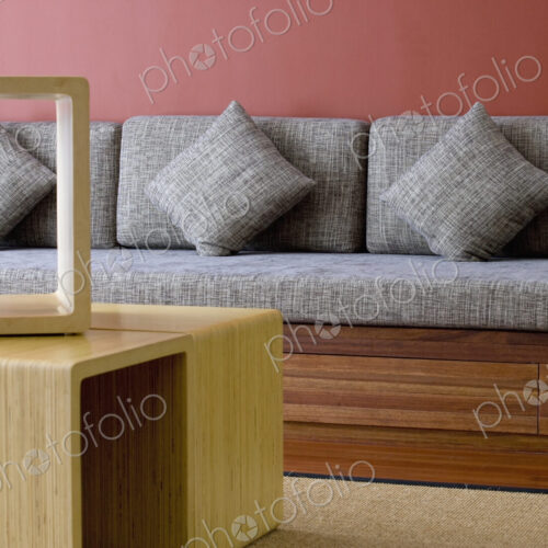 Seating bench with cushions and coffee table. Seating bench with cushions and coffee table.