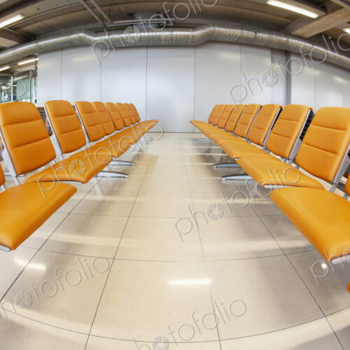 Seats in waiting area at airport.